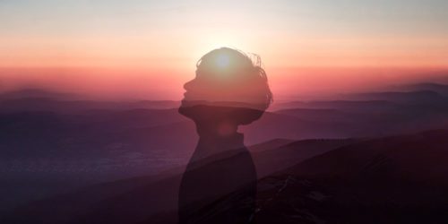 Silhouette of person against sunset