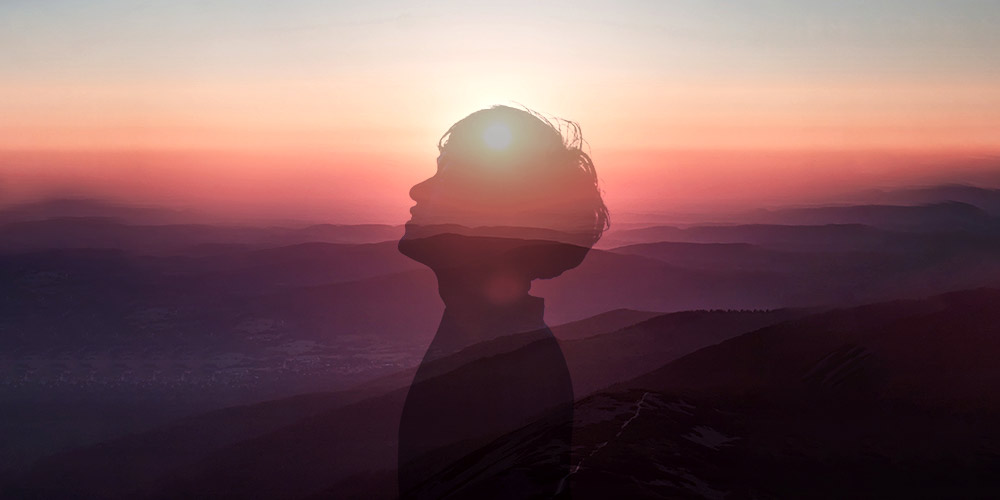 Silhouette of person against sunset